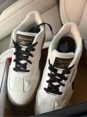 Reebok women’s White Sneakers with Black Laces & Gold Logo